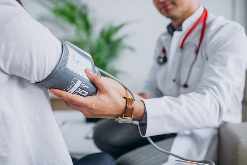 Doctor checking a patient during an in-house clinic consultation