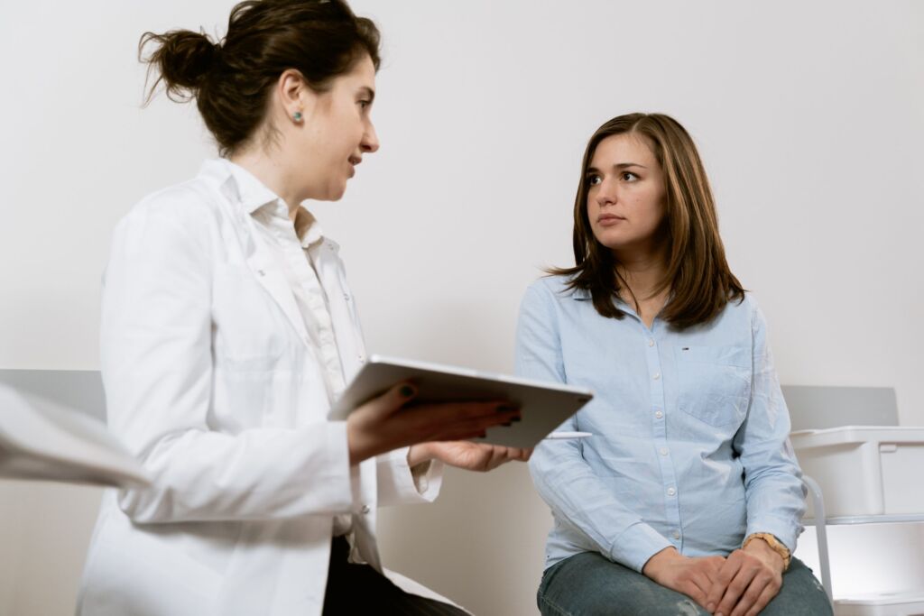 Doctor speaking with a patient during a workplace medical assessment