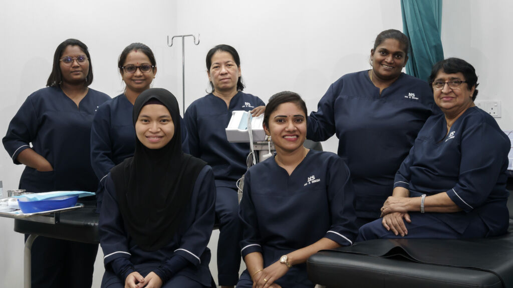 KNS clinic team gathered in a treatment room